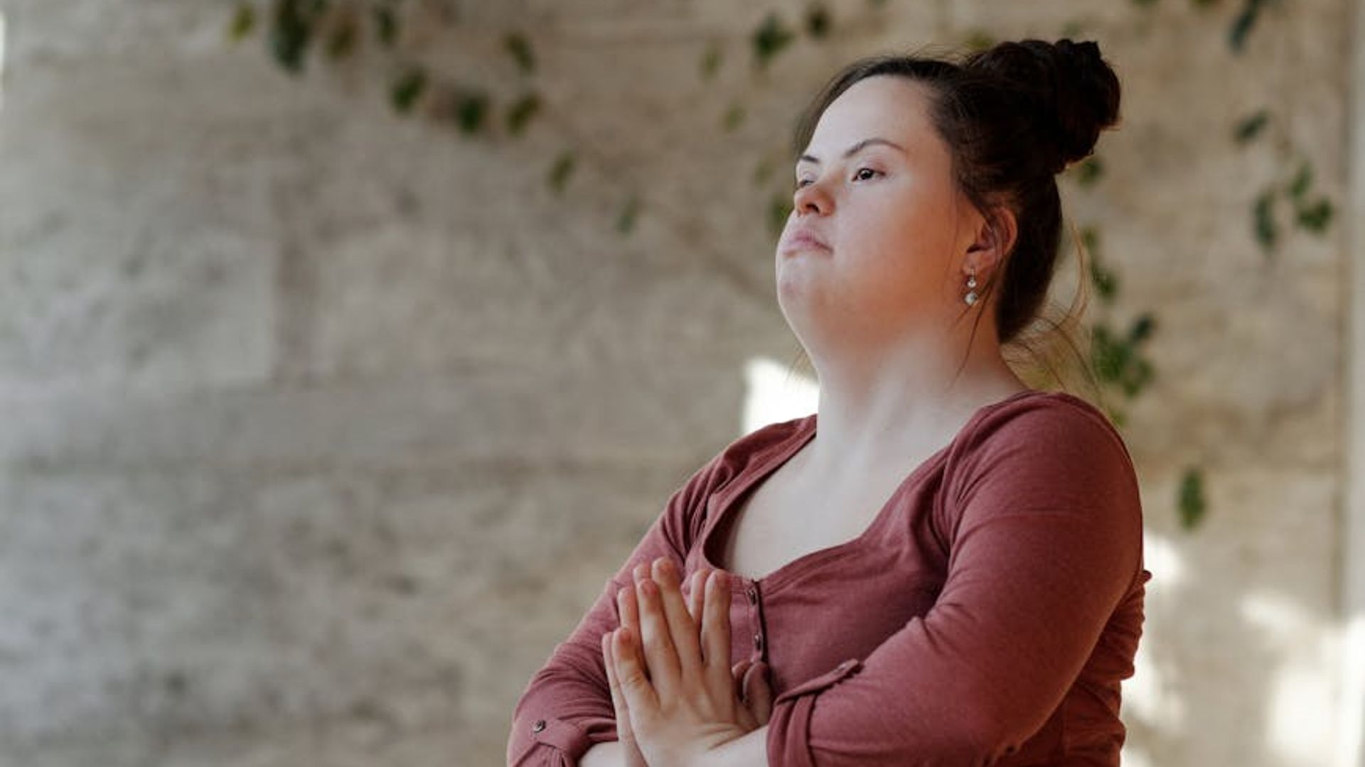 Atmospheric morning yoga session in a quiet dark studio.